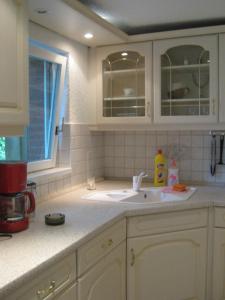 Kuchyň nebo kuchyňský kout v ubytování Kinkerbungalow + 12 fotografií