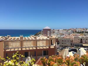 a view of a city and the ocean at Tajinaste Sol in Morro del Jable