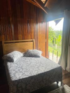 Ένα ή περισσότερα κρεβάτια σε δωμάτιο στο Chalé Lorenzo