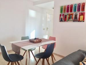 a dining room with a table and chairs at Tajinaste Sol in Morro del Jable +18 photos