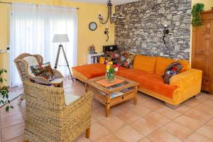 a living room with a couch and chairs and a table at Ferienhaus Am Bodensee Mit Garten Und Terrasse in Radolfzell am Bodensee