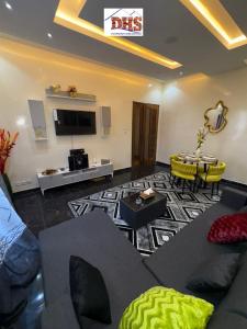 a living room with a couch and a table at DHSimmo Cozy home in Rufisque