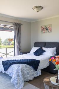 Ένα ή περισσότερα κρεβάτια σε δωμάτιο στο Keogans View - Spectacular Mountain & Ocean Views