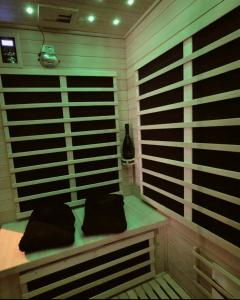 a room with a bench with two pillows on it at La Bulle de Velours in Bouguenais