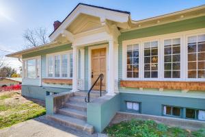 a green house with a door and stairs in front at 1 Mi to Pendleton Round-Up Historic Elnor Home in Pendleton
