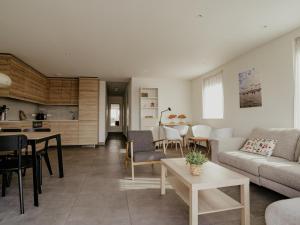 a living room with a couch and a table at Waterfront in Uitgeest