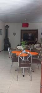 a dining room with a table and chairs at Casa da Carmem in São Gabriel