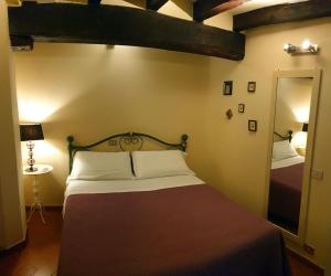 Ένα ή περισσότερα κρεβάτια σε δωμάτιο στο Mosaico ApartHotel