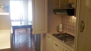 Η κουζίνα ή μικρή κουζίνα στο Mosaico ApartHotel +2 φωτογραφίες