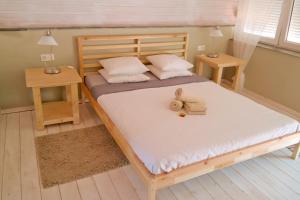 Postel nebo postele na pokoji v ubytování Sansofi Guesthouse