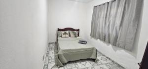 Postel nebo postele na pokoji v ubytování casa da Cilene