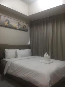 Ένα ή περισσότερα κρεβάτια σε δωμάτιο στο 130 Sqm Luxurious Modern 3 Bedrooms Facing Manila Bay Sunset, Airports, Okada, Solaire, MOA with Free Parking +34 φωτογραφίες