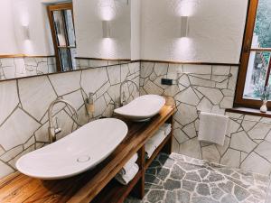 a bathroom with a sink and a mirror at Studio Wasserfall in Flattach +25 photos