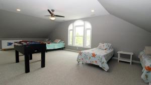 Voodi või voodid majutusasutuse Sunset Breeze Manor toas