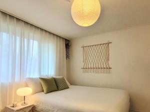 Postel nebo postele na pokoji v ubytování 키 스테이, 김포공항 근처