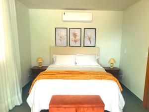 Ένα ή περισσότερα κρεβάτια σε δωμάτιο στο SKYHOUSE BOUTIQUE - Loft & SPA - piscina aquecida e sauna privativa - Centro, Domingos Martins