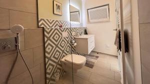 Koupelna v ubytování Apartment Marktgeflüster + 19 fotografií