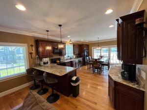 a large kitchen with a island in a room at Cal56Right in Alton