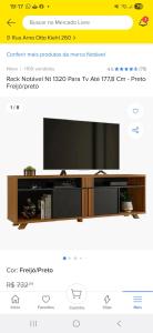 a flat screen tv sitting on top of a wooden entertainment center at Quarto com ar condicionado tv para uma pessoa in Passo Fundo