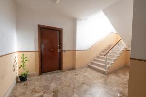 an empty hallway with stairs and a door at 325 - Casa Pede a Deiva Marina - 300metri dalla Spiaggia e dal Mare e dal Centro Storico in Deiva Marina +38 photos