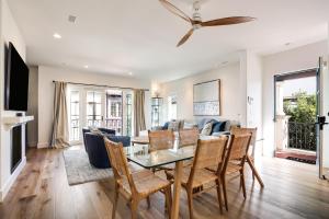 a living room with a table and chairs at Casa Playa in Santa Barbara
