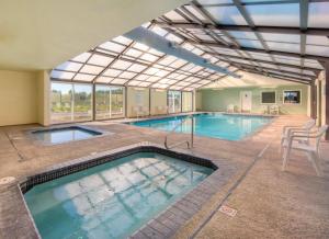 a large swimming pool with a large glass ceiling at WorldMark Surfside Inn in Ocean Park
