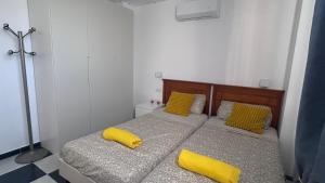 Postel nebo postele na pokoji v ubytování Planta Baja en La Zenia Beach