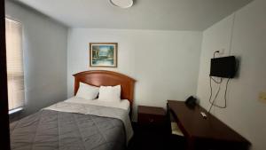 Voodi või voodid majutusasutuse Chinatown Hotel Chicago toas