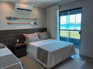 Postel nebo postele na pokoji v ubytování Éolos Loft's - Cabo Frio