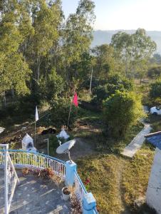 a view from the balcony of a house at Pinewood Retreat in Bilāspur