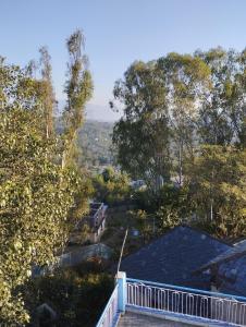 a view from the roof of a house at Pinewood Retreat in Bilāspur +1 photo