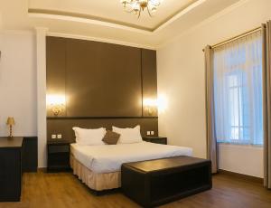 Ένα ή περισσότερα κρεβάτια σε δωμάτιο στο Hotel Purnama Lenggang