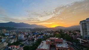 a view of a city at sunset at Sagarmatha Apartment Hotel in Pātan