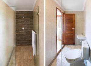 a bathroom with a toilet and a glass shower at Villa Pantina Bali in Uluwatu +29 photos
