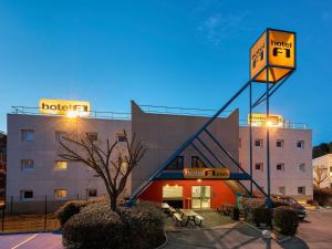 a hotel with a sign in front of a building at hotelF1 Nantes Ouest Saint-Herblain in Saint-Herblain