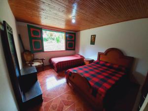 Postel nebo postele na pokoji v ubytování Villa Alejandra