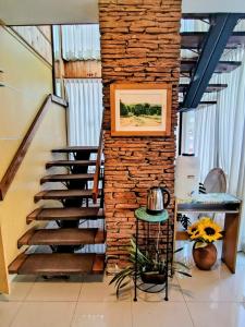 a brick wall with a staircase in a room at Hotel Ritz in Villa Carlos Paz +31 photos