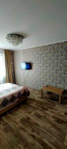 Ένα ή περισσότερα κρεβάτια σε δωμάτιο στο Рахмет