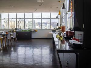 a kitchen with a floor that is flooded with water at Hotel 3 Rios Plaza in Três Rios