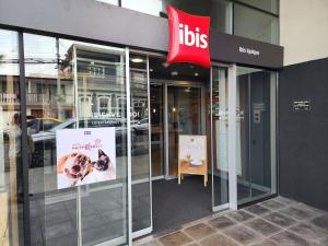 a ups store with a sign on the side of a building at ibis Iquique in Iquique
