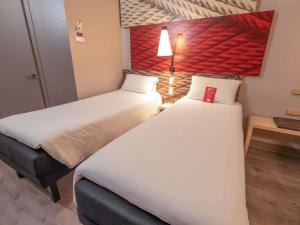 Postel nebo postele na pokoji v ubytování ibis Iquique