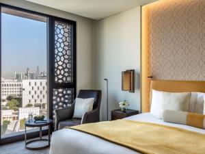 Voodi või voodid majutusasutuse Alwadi Hotel Doha - MGallery Collection toas +179 fotot