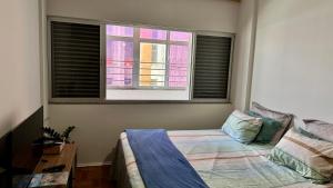 Una cama o camas en una habitación de Quarto Recife