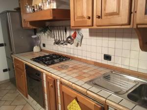 a kitchen with a sink and a stove top oven at Mia in Marina di Massa