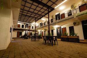 a room with tables and chairs in a building at El Bakatir in Banyuwangi +15 photos