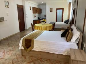 Ένα ή περισσότερα κρεβάτια σε δωμάτιο στο Mahe Holiday Resort