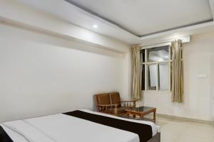 Voodi või voodid majutusasutuse Townhouse Shivamogga Railway Junction Formerly Amma Residency toas