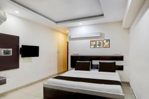 Voodi või voodid majutusasutuse Townhouse Shivamogga Railway Junction Formerly Amma Residency toas