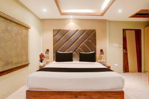 Voodi või voodid majutusasutuse Super Townhouse Oak Amity University Patna Formerly The Golden Crown toas