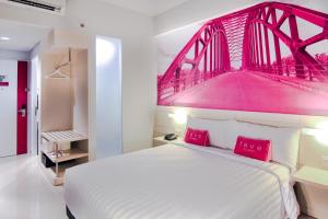 Letto o letti in una camera di favehotel Sudirman Bojonegoro